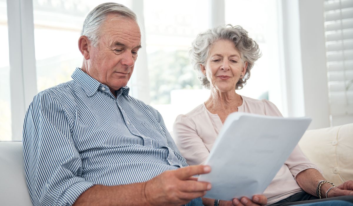 Protea Financial Commercial Insurance Policy older couple looking over paperwork presumably their insurance policy