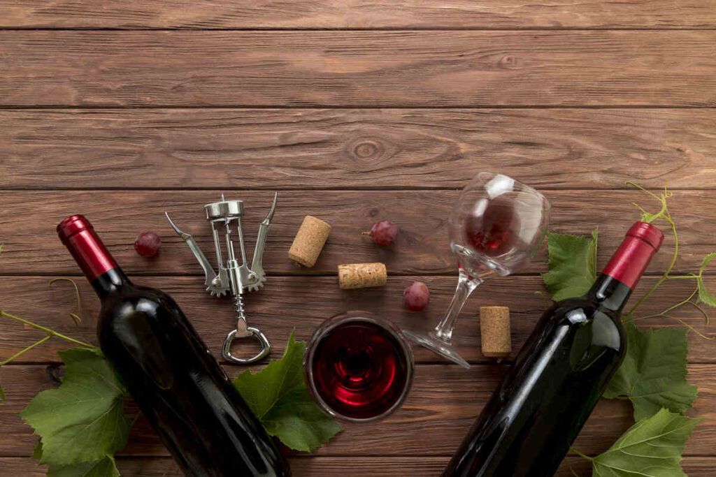 top view wine bottles wooden background