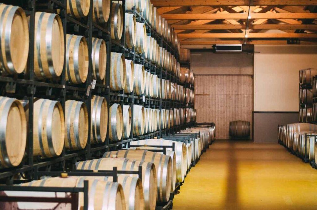 wood wine barrels stored in winery inventory